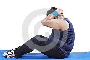 Overweight man doing sit-up