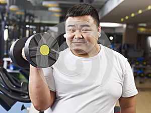 Overweight man exercising photo