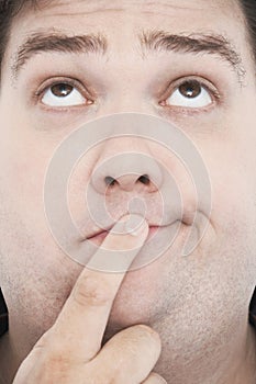 Overweight Man With Finger On Mouth