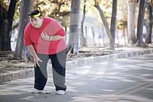 Overweight man having heart pain after running