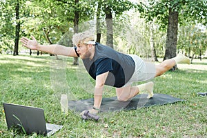 Overweight man training in the park