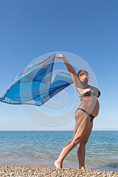 Overweight middle aged woman at the sea