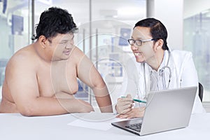 Overweight patient consultation at doctor