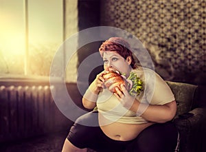 Overweight woman eats sandwich, bulimic