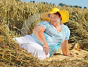 Overweight woman enjoying life during summer vacations.