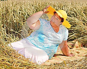 Overweight woman enjoying life during summer vacations.