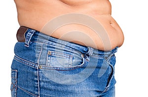 Overweight woman getting dressed wearing jeans