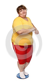 Overweight woman on gymnastic disc