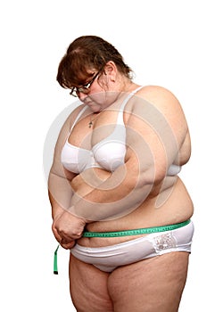 Overweight woman measure her stomach