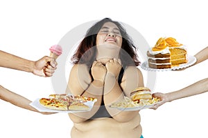 Overweight woman rejecting unhealthy food