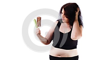 Overweight woman resists to eat ice-cream. Healthy food concept.