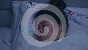 Overweight woman sleeping and snoring in bed