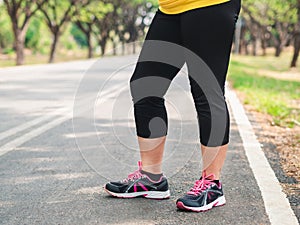 Overweight woman standing in the park before running. Weight loss concept photo
