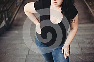 Overweight woman suffering from breathe shortness stepping on st