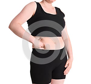 Overweight woman touching belly fat before weight loss