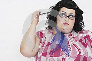 Overweight Woman Twisting Strand Of Hair