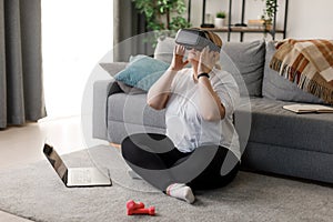 Overweight woman using VR headset