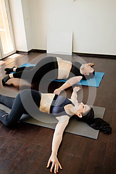 Overweight woman working out with personal trainer