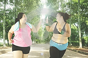 Overweight women workout at park