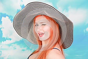 Overweight young woman in swimsuit near the sea. Size plus studio shot