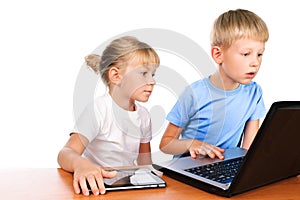 Overwhelmed boy and girl using laptop