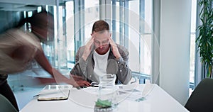 Overwhelmed businessman with headache, burnout or stress with crisis, fatigue or depression in office. Time lapse