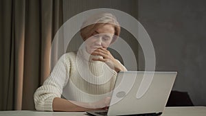 Overwhelmed Office Worker Taking a Break at Her Desk During a Stressful Day