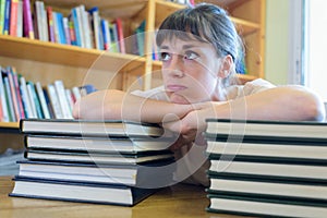 overwhelmed woman leaning on stack books