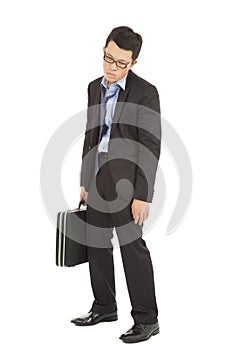 Overwork and exhausted businessman holding briefcase
