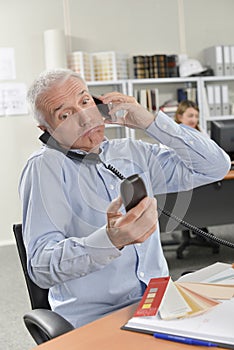 Overworked boss on phone