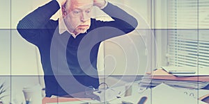 Overworked businessman sitting at a messy desk, geometric pattern