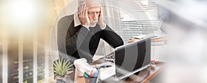 Overworked businessman sitting at a messy desk; multiple exposure