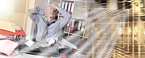 Overworked businessman sitting at a messy desk; multiple exposure