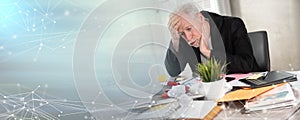 Overworked businessman sitting at a messy desk; panoramic banner