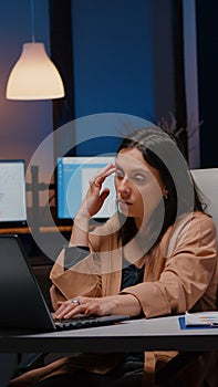 Overworked exhausted businesswoman working in startup office checking management strategy