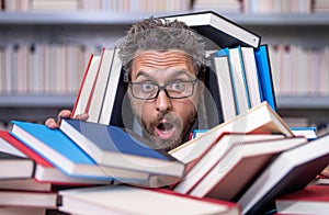 overworked man student reading book in a book store or school library. surprised literature teacher in school with book