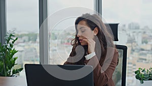 Overworked office manager sitting at work desk close up. Woman feeling exhausted