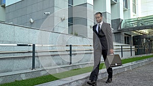 Overworked office worker walking by business center burnout at work avitaminosis
