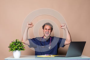 Overworked young doctor sitting in his office