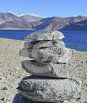 An Ovoo or a sacred pile of rocks at the Pangong lake in Ladakh in the state of Jammu and Kashmir