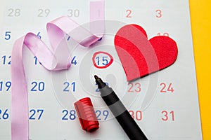Ovulation date marked on calendar, trying to conceive. Planning of pregnancy concept photo