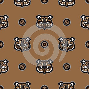 Owl face seamless pattern in boho style. Good for clothing and textiles. Vector