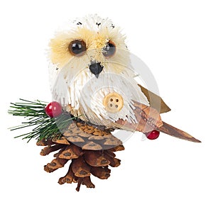 Owl sitting on cones, red berries,christmas decoration