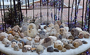 Owls and Other Stone Critters Arranged Atop Concrete Fountain