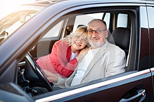 Own Car. Portrait Of Happy Senior Couple Sitting In Their New Automobile