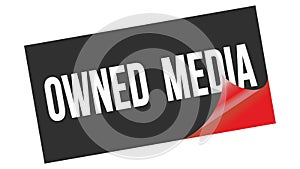 OWNED  MEDIA text on black red sticker stamp