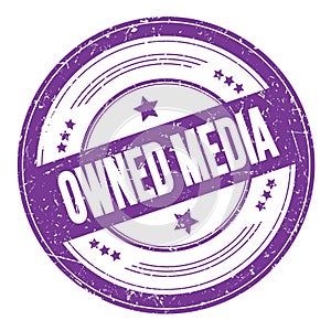 OWNED MEDIA text on violet indigo round grungy stamp
