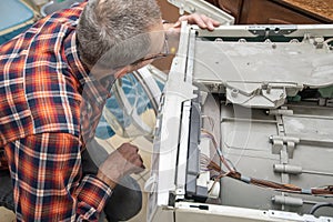 The owner is a jack of all trades who can fix a broken washing machine himself, detect the breakdown and fix it,