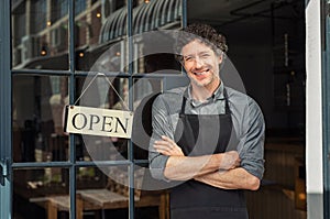 Owner standing outside restaurant