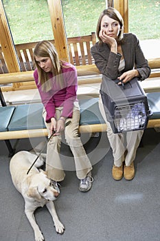 Owners Sitting In Vets Reception Area